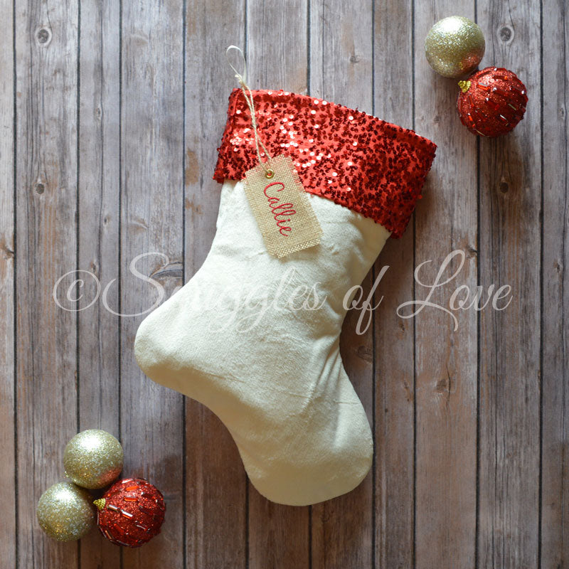 Cream velvet Christmas stocking with red sparkle sequin cuff and name tag