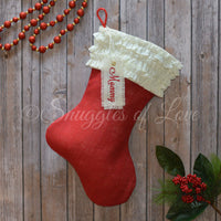 Red burlap Christmas stocking with ivory ruffle cuff and personalized tag