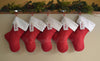 Set of 5 red burlap personalized Christmas stockings with hanging tags
