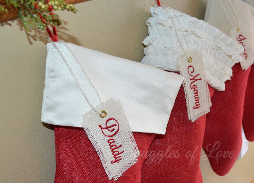 Red burlap and satin Christmas stocking with personalized hanging tag